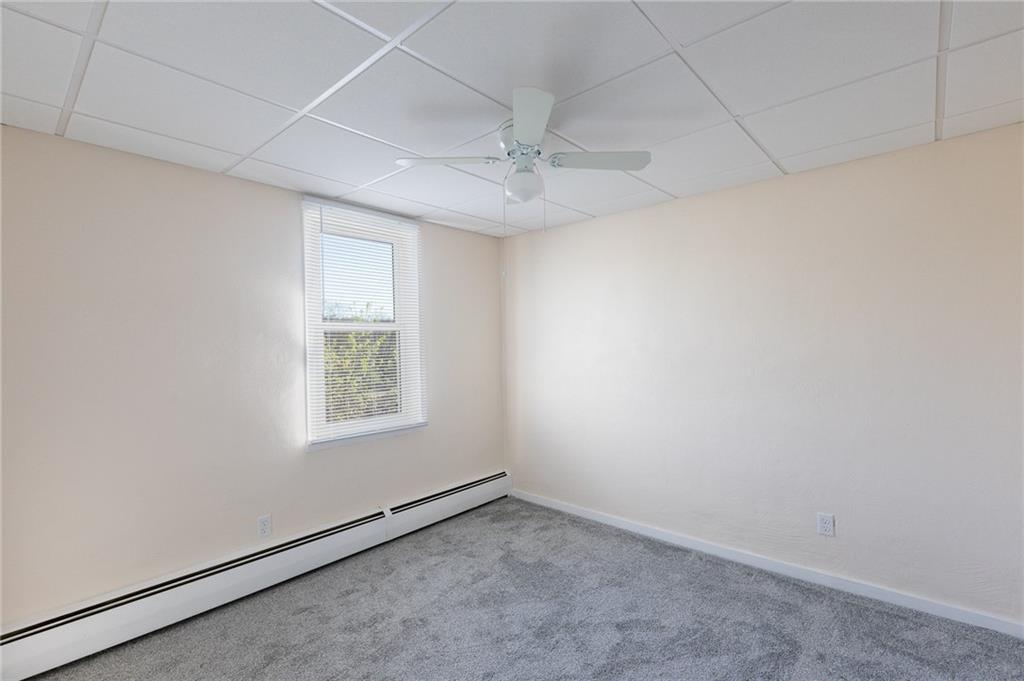 3 Alice Street McKees Rocks, PA 15136 - Photo 22 of 25 an empty room with windows and fan