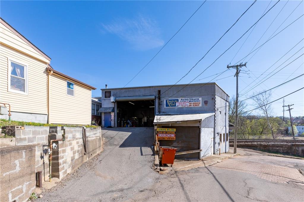 3 Alice Street McKees Rocks, PA 15136 - Photo 4 of 25 a view of a patio with a table and chairs under an umbrella