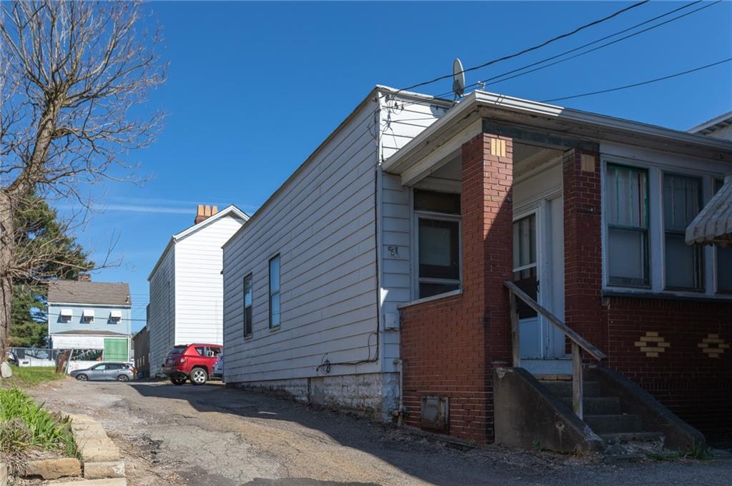 3 Alice Street McKees Rocks, PA 15136 - Photo 10 of 25 a front view of a house with a yard