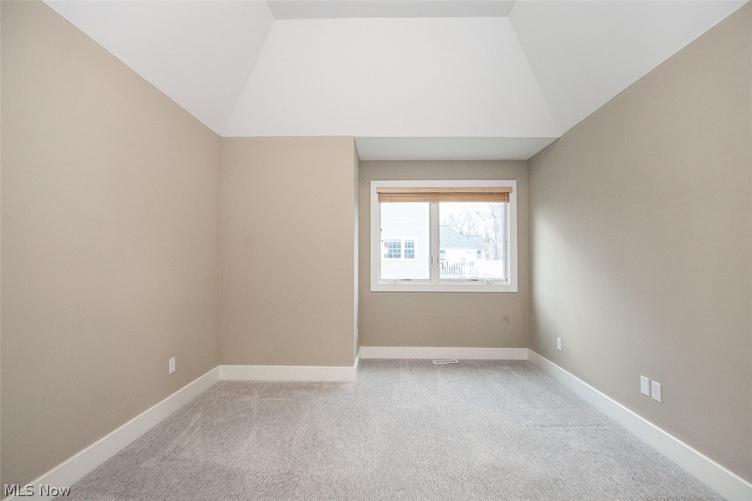7282 Holzhauer Road Northfield, OH 44067 - Photo 19 of 47 Guest bedroom with vaulted ceiling