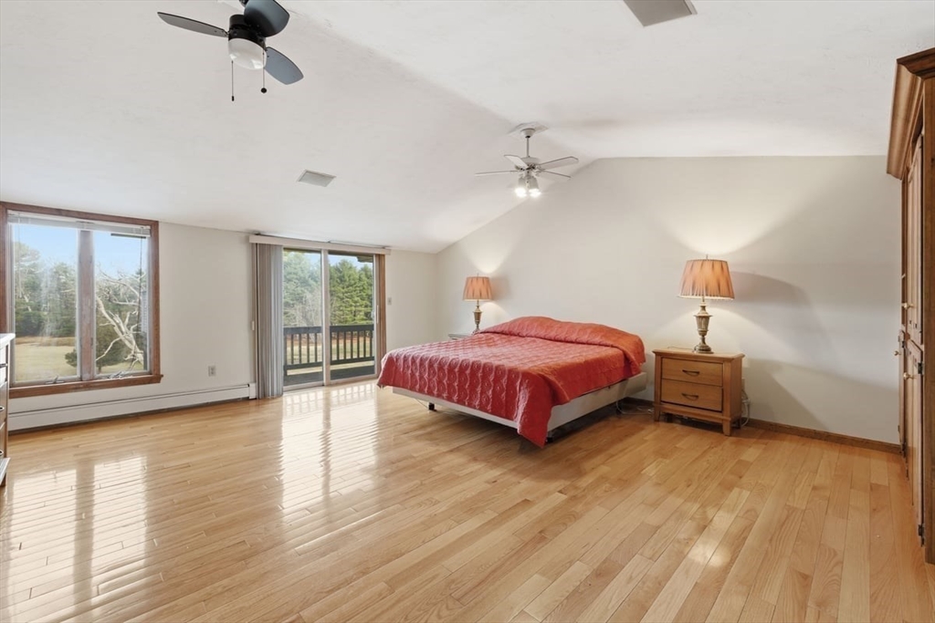 64 Village Street Millis, MA 02054 - Photo 20 of 41 a bedroom with a bed and wooden floor