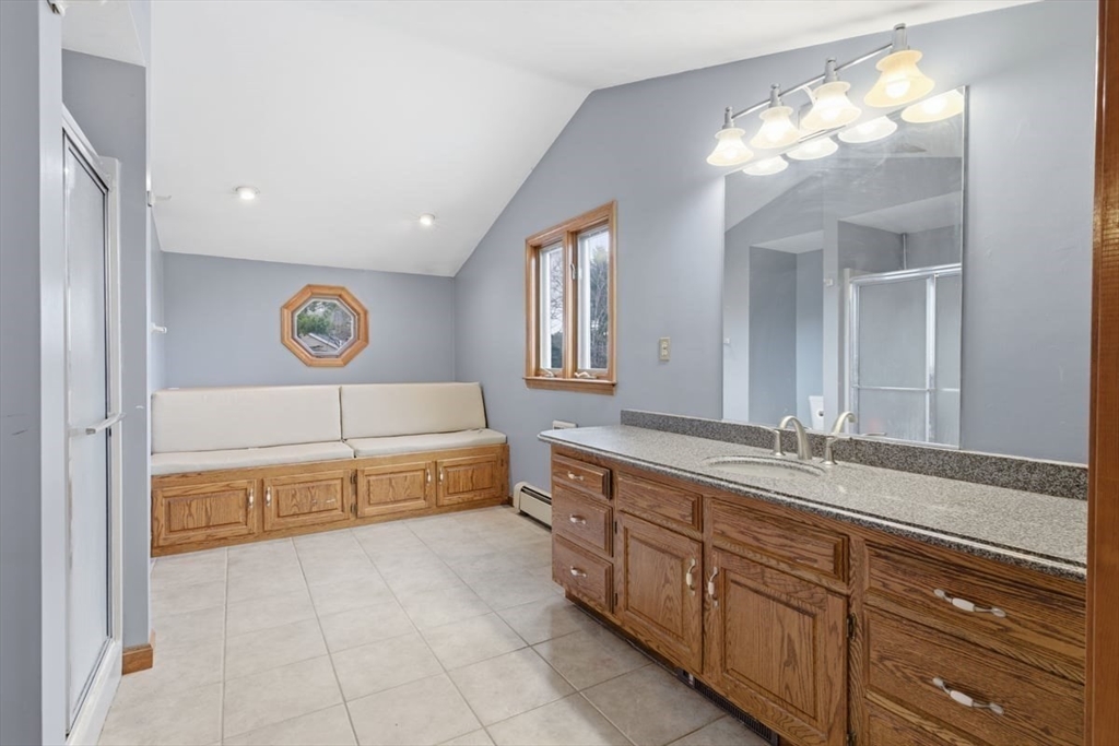 64 Village Street Millis, MA 02054 - Photo 23 of 41 a spacious bathroom with a tub sink and mirror