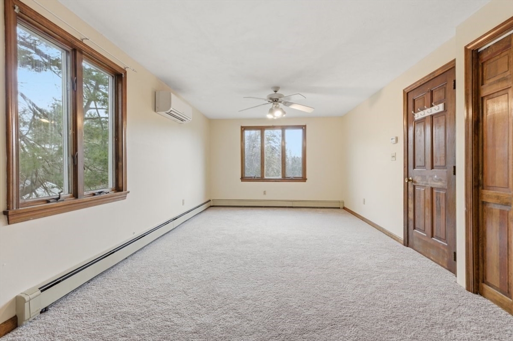 64 Village Street Millis, MA 02054 - Photo 26 of 41 a view of an empty room with a window