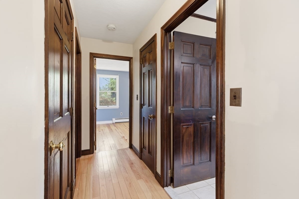 64 Village Street Millis, MA 02054 - Photo 29 of 41 a view of a hallway with wooden floor