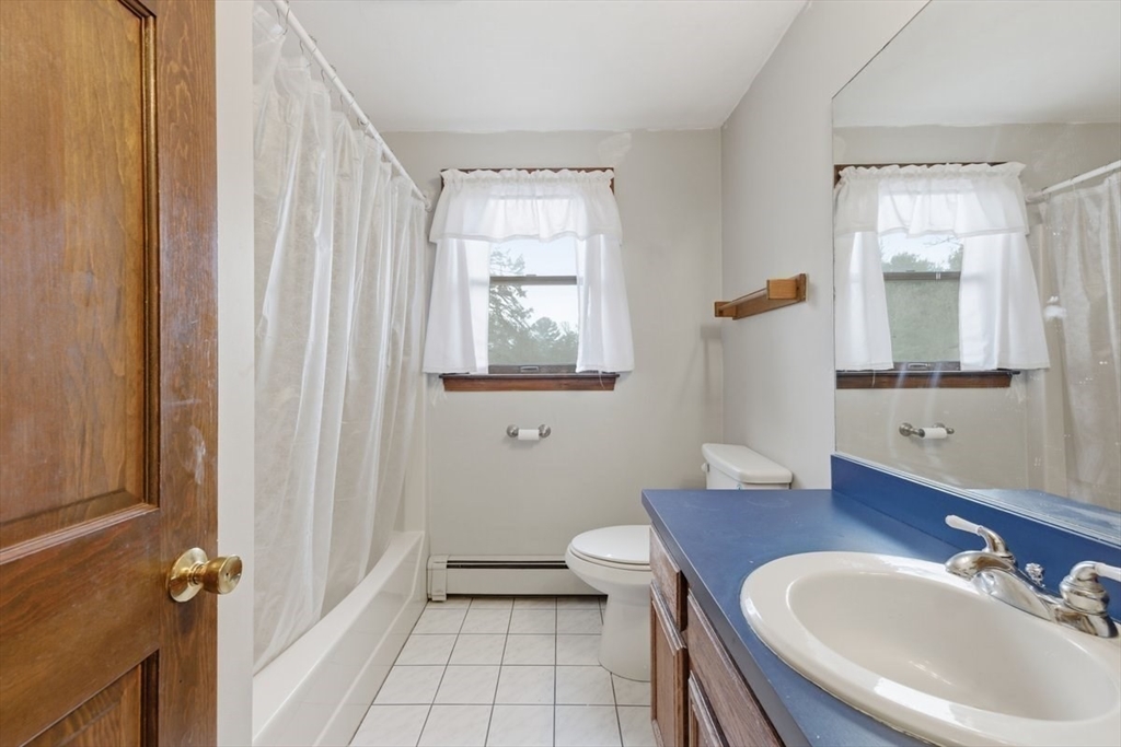 64 Village Street Millis, MA 02054 - Photo 30 of 41 a bathroom with a sink and a mirror