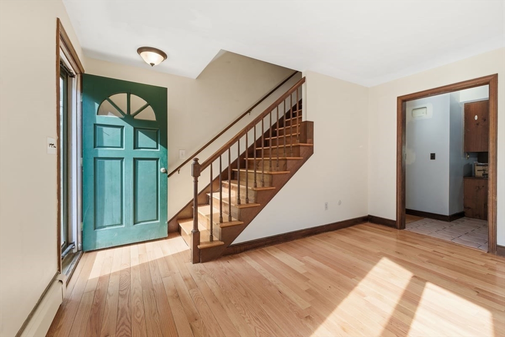 64 Village Street Millis, MA 02054 - Photo 3 of 41 a view of an entryway with wooden floor