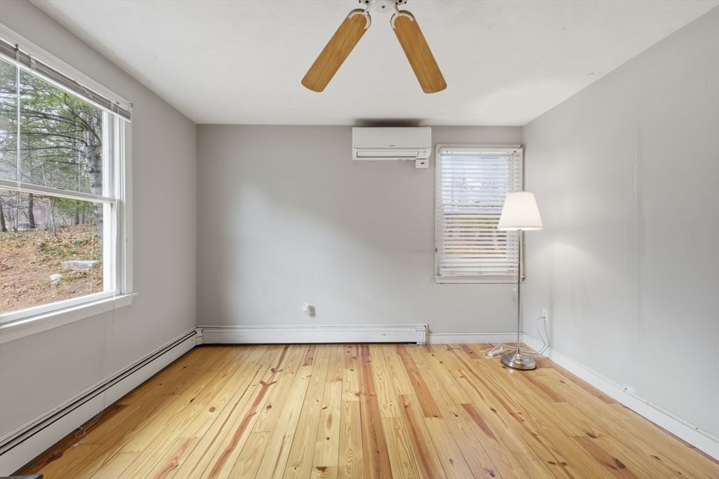64 Village Street Millis, MA 02054 - Photo 34 of 41 a view of empty room with wooden floor and fan