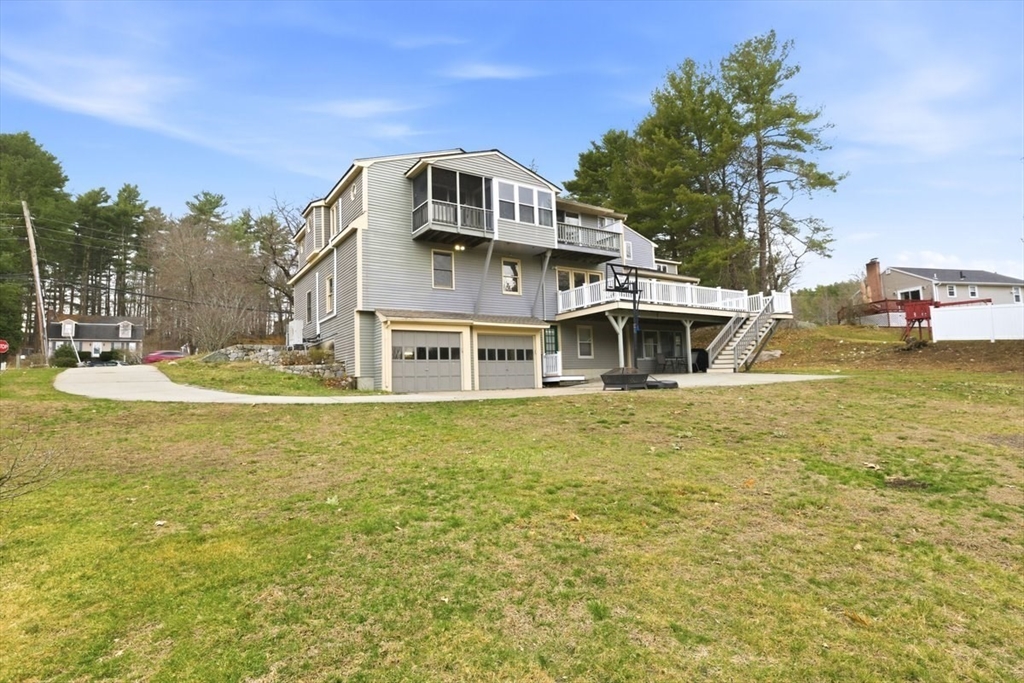64 Village Street Millis, MA 02054 - Photo 37 of 41 a front view of a house with a yard