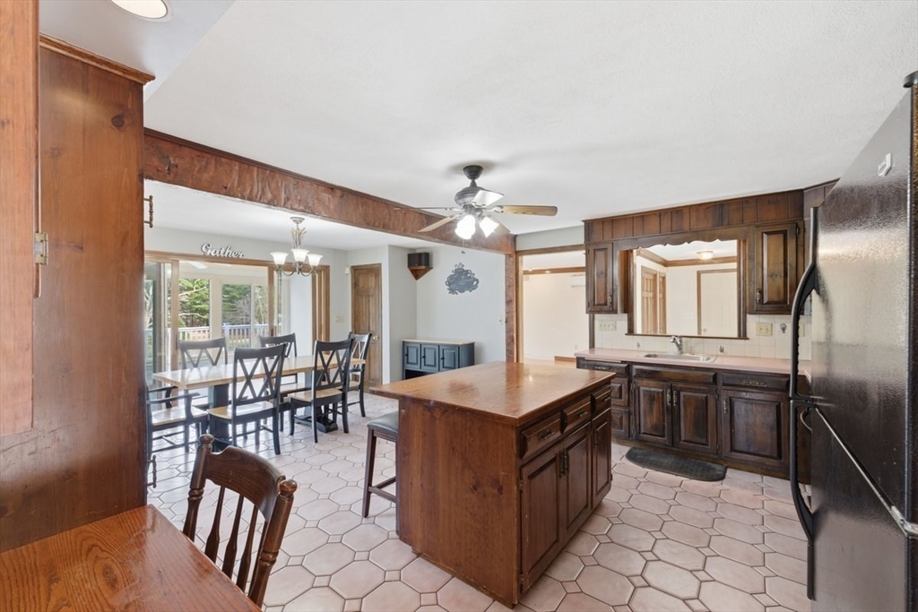 64 Village Street Millis, MA 02054 - Photo 5 of 41 a kitchen with sink cabinets and outdoor view