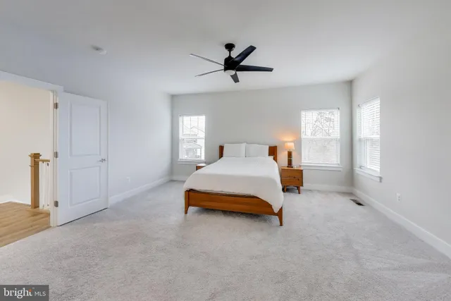 a large white bed in a white room