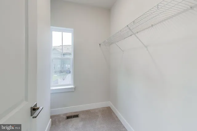 a picture of a white bench sitting in front of a door