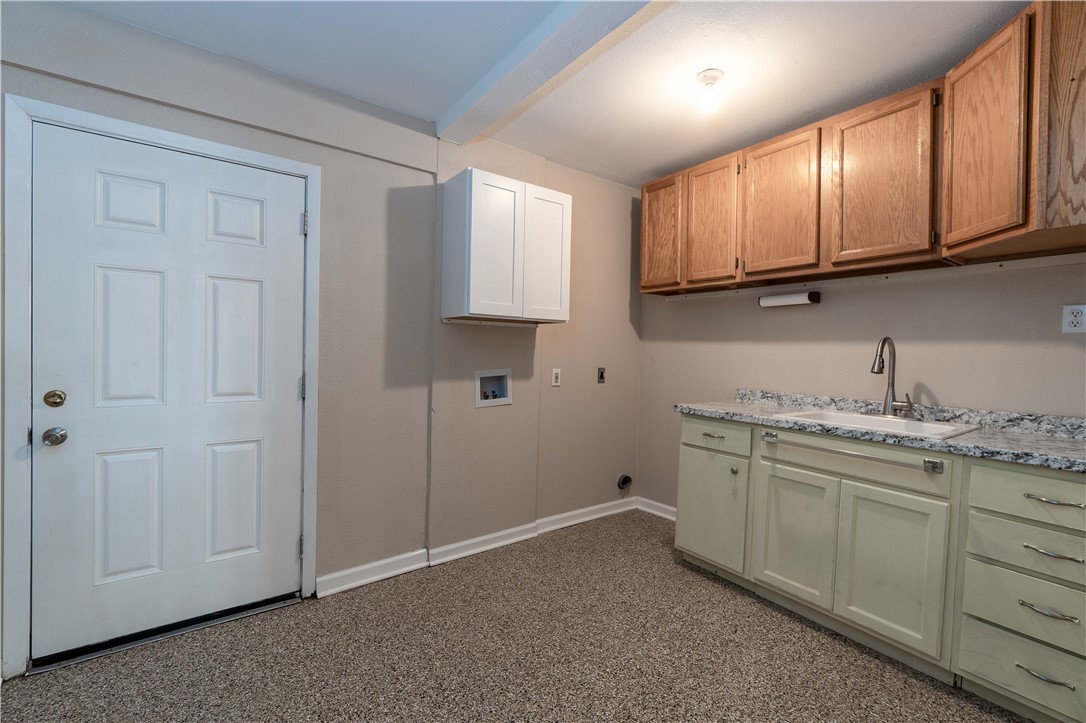 6232 Weber Road Corpus Christi, TX 78413 - Photo 10 of 23 a view of cabinets a sink and a stove in a room