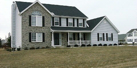 10596 Chicory Ridge Way Roscoe, IL 61073 - Photo 1 of 6 a front view of a house with a yard