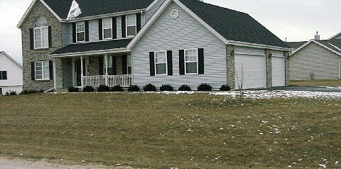 10596 Chicory Ridge Way Roscoe, IL 61073 - Photo 2 of 6 a front view of a house with a yard