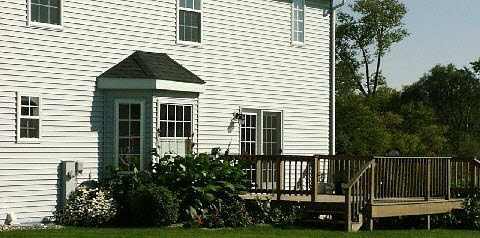 10596 Chicory Ridge Way Roscoe, IL 61073 - Photo 4 of 6 a front view of a house with garden