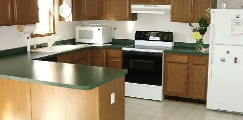 10596 Chicory Ridge Way Roscoe, IL 61073 - Photo 6 of 6 a kitchen with stainless steel appliances granite countertop a sink a stove and a refrigerator