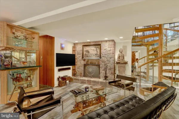 a bathroom with a granite countertop sink mirror and toilet