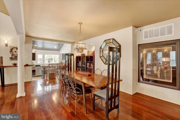 a living room with furniture a rug and a table