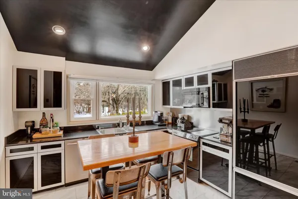 a dining room with furniture and wooden floor