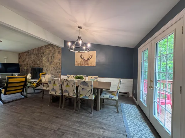 a kitchen with a sink a window stainless steel appliances and cabinets