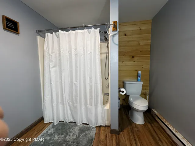 a spacious bedroom with a bed and window