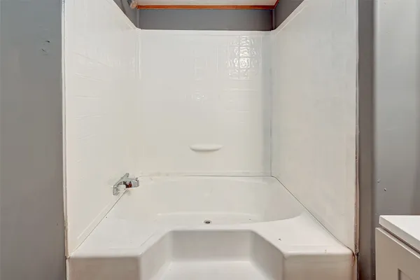 a bathroom with a bathtub