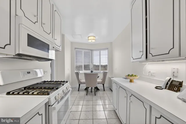 a kitchen that has a sink and a stove