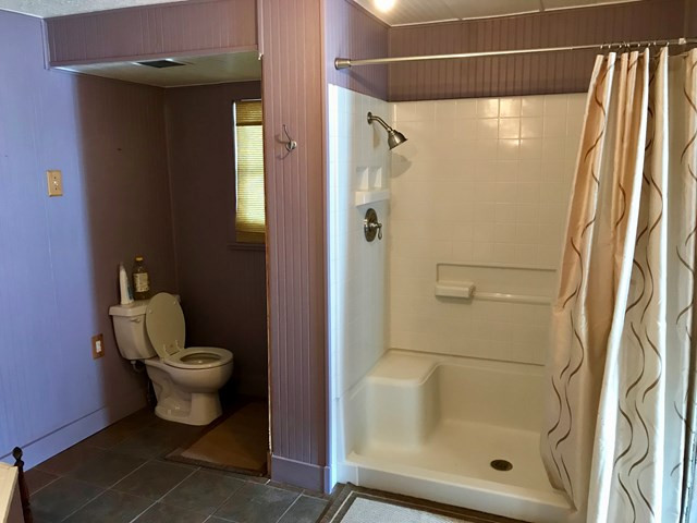 54 Country Place Road Edgefield, SC 29824 - Photo 11 of 18 a bathroom with a shower and toilet