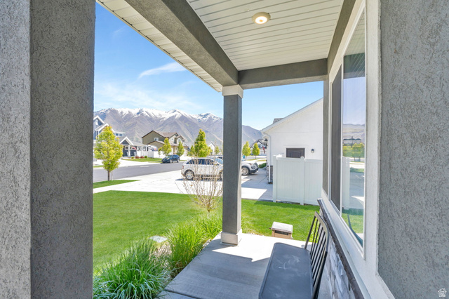 646 South Meade Street Mapleton, UT 84664 - Photo 34 of 46 Covered porch with textured stucco exterior and vertical siding on the soffit