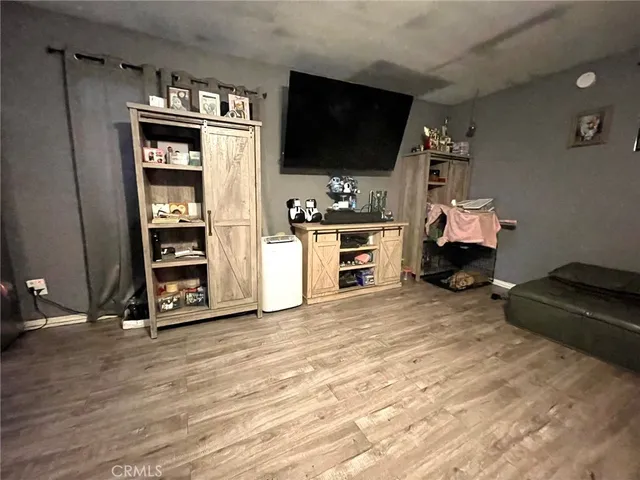 a room with furniture and a flat screen tv