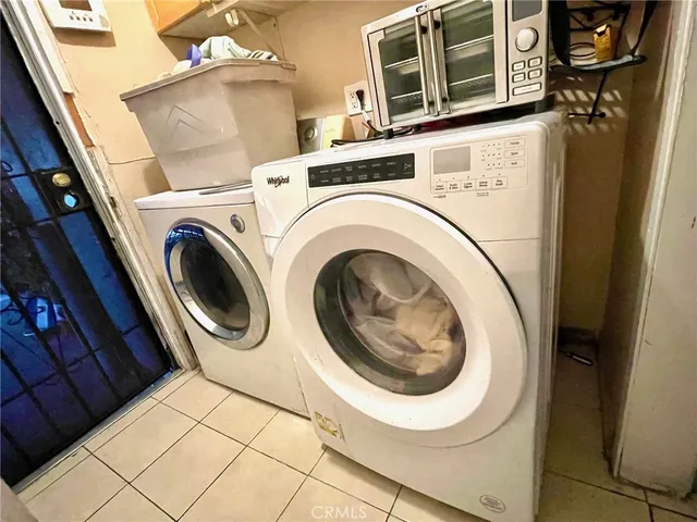 a bedroom with a bed and a table in it