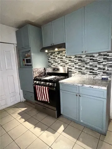 a kitchen with cabinets and appliances