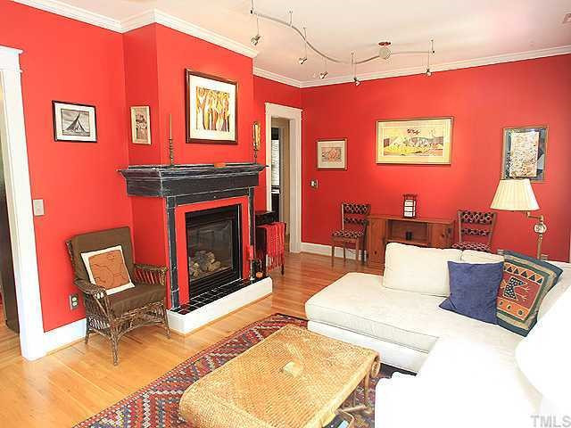 709 Holden Street Raleigh, NC 27604 - Photo 2 of 11 Spacious light filled family room offers a gas log fireplace. Notice the hardwoods that run throughout the home and the 9 foot smooth ceilings that set this home apart from the rest.