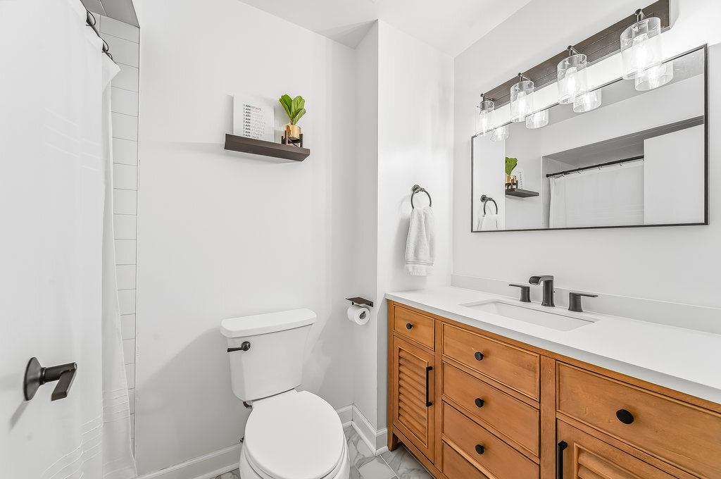 90 Golfview Lane, Unit D Frankfort, IL 60423 - Photo 20 of 27 a bathroom with a sink mirror vanity and toilet