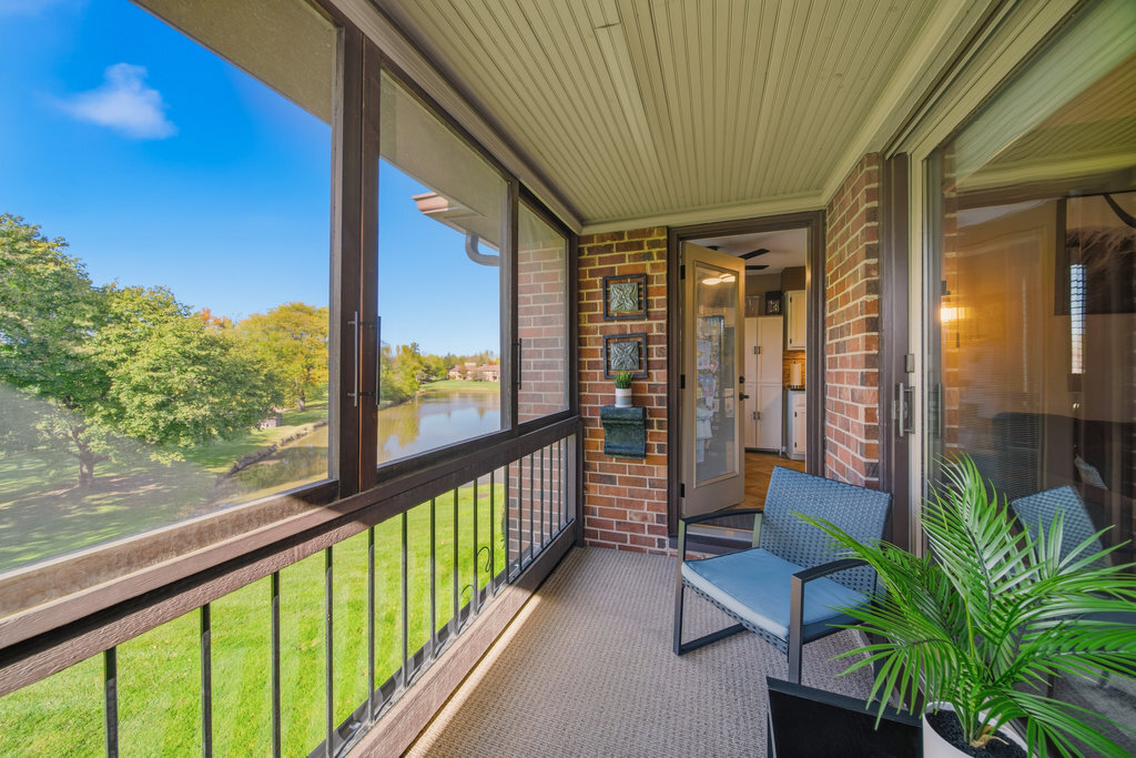 90 Golfview Lane, Unit D Frankfort, IL 60423 - Photo 21 of 27 a view of a porch with furniture and garden