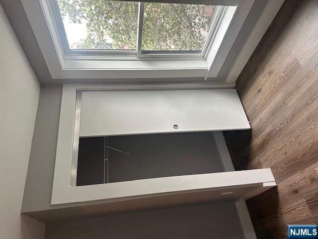 116 Washington Street, Unit 3D Newark, NJ 07102 - Photo 11 of 12 an empty room with wooden floor and windows
