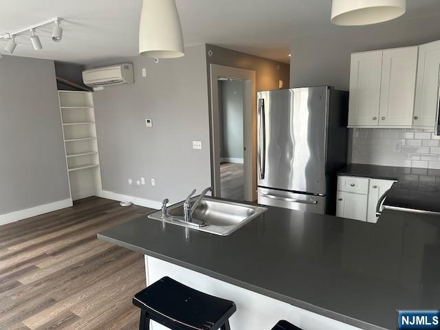 116 Washington Street, Unit 3D Newark, NJ 07102 - Photo 4 of 12 a kitchen with stainless steel appliances a refrigerator and a stove