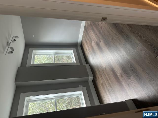 116 Washington Street, Unit 3D Newark, NJ 07102 - Photo 5 of 12 a view of an empty room with wooden floor and a window