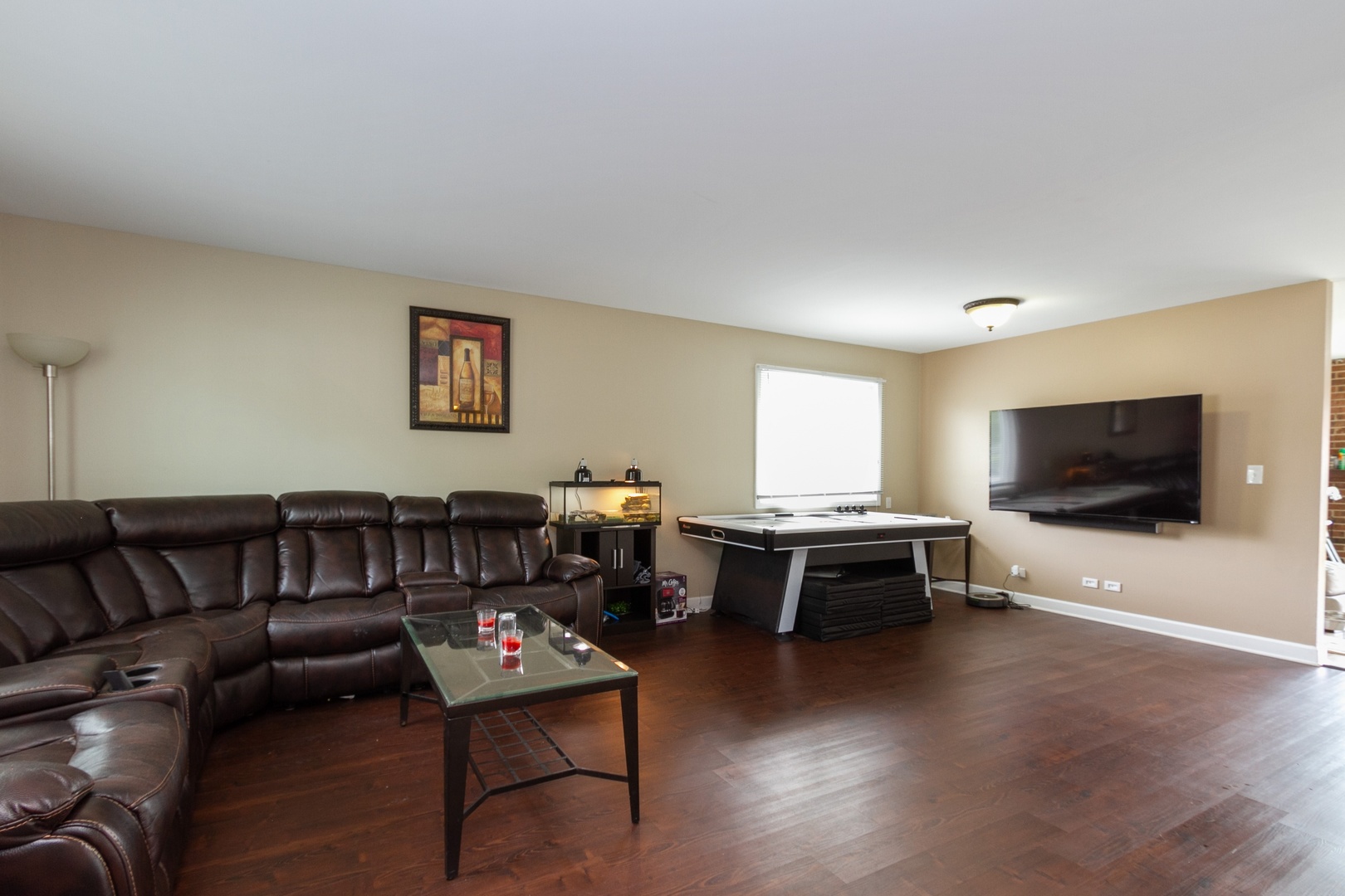 29 Pheasant Road Matteson, IL 60443 - Photo 2 of 10 a living room with furniture and a flat screen tv