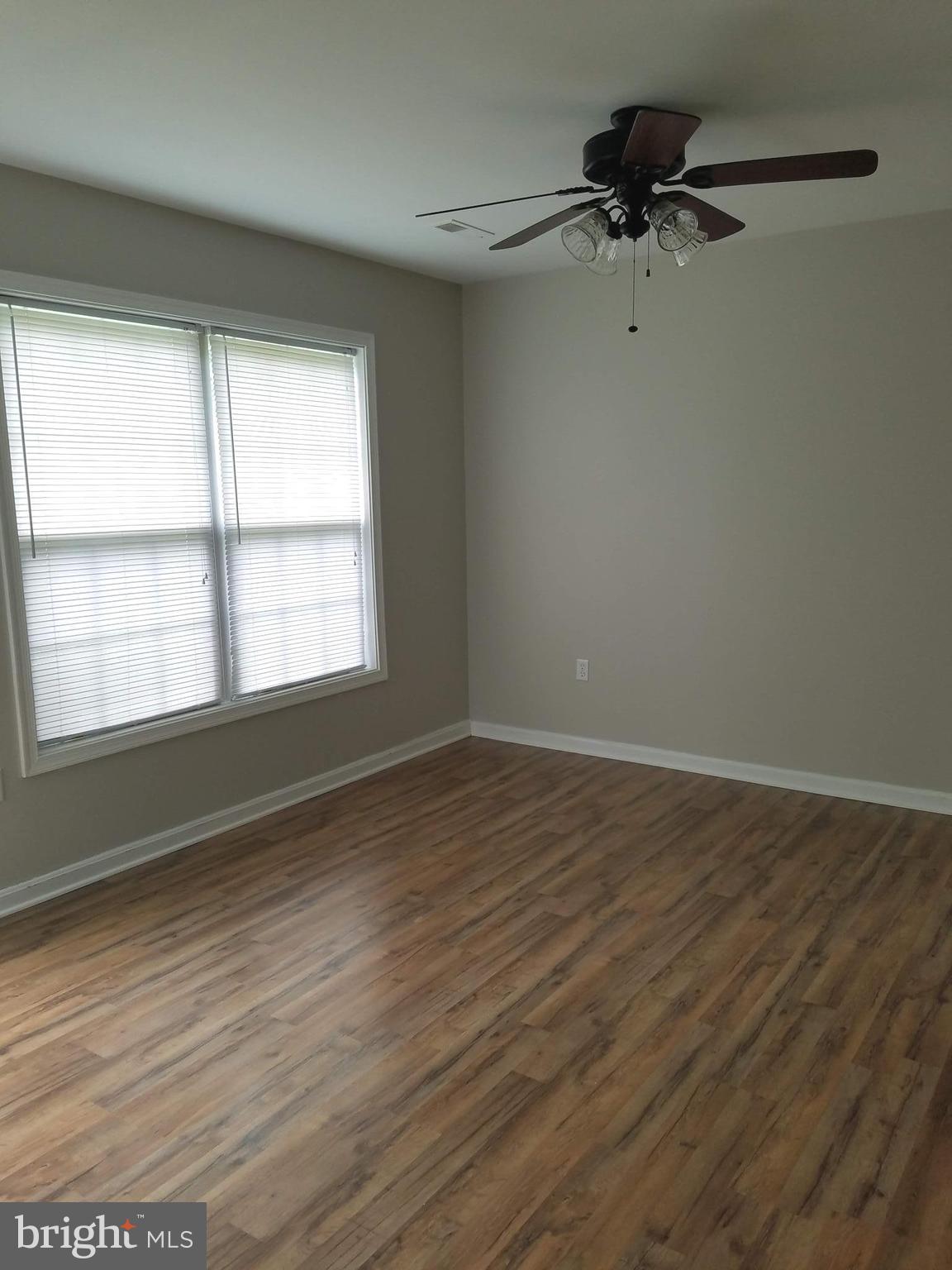 1776 Birch Drive Culpeper, VA 22701 - Photo 2 of 12 a view of an empty room with a window and a wooden floor