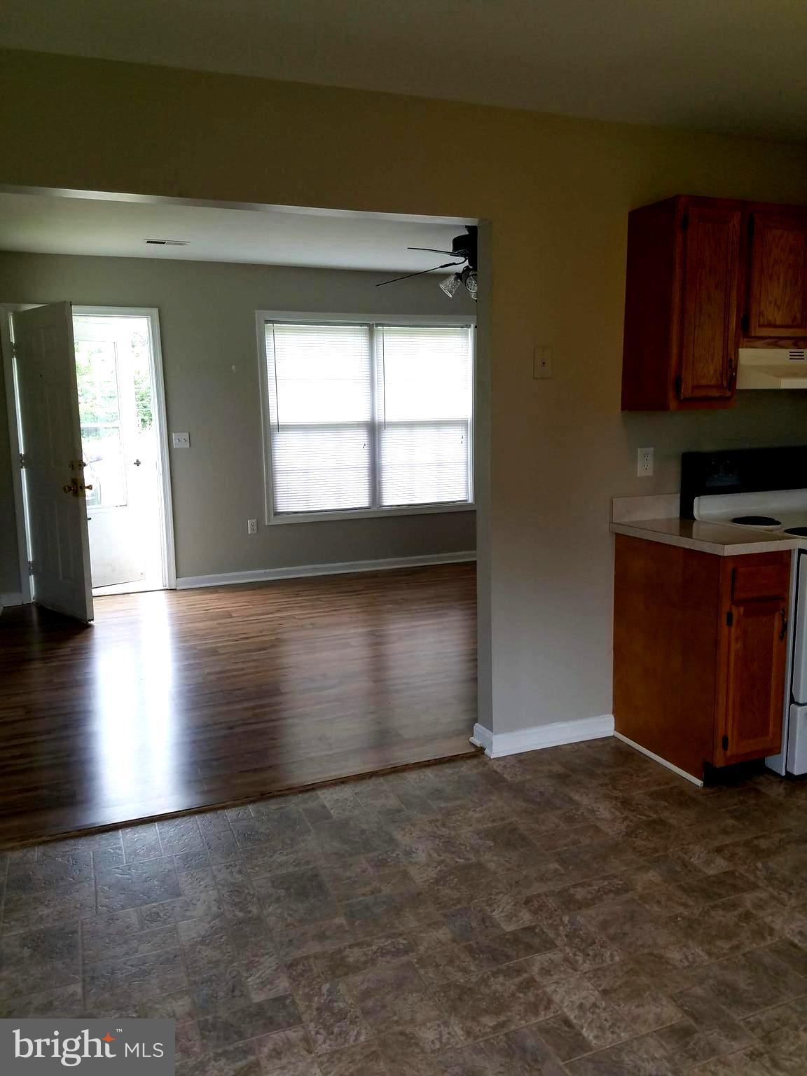 1776 Birch Drive Culpeper, VA 22701 - Photo 3 of 12 a view of empty room with kitchen and window