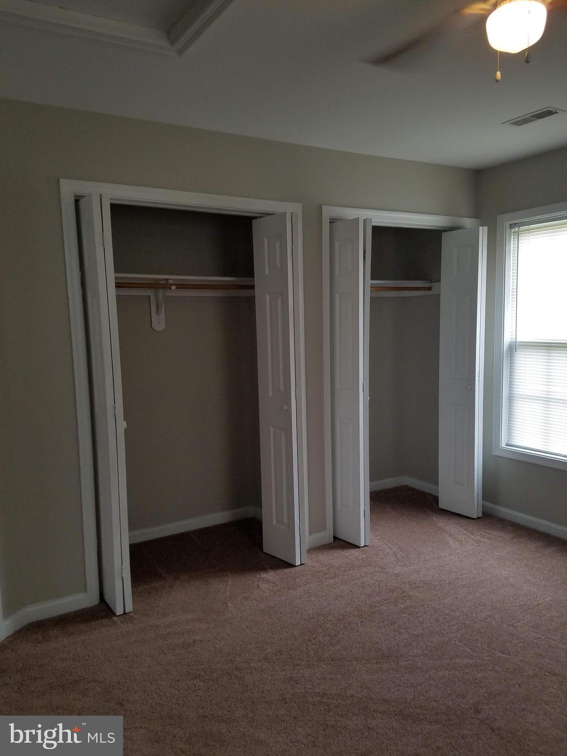 1776 Birch Drive Culpeper, VA 22701 - Photo 7 of 12 an empty room with closet and windows