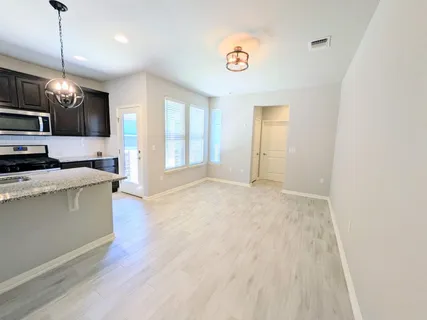 a view of kitchen and microwave