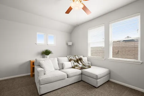 a living room with furniture and a window