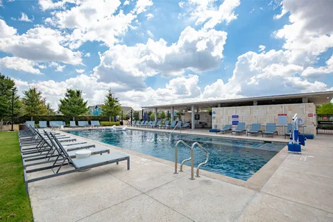 a view of roof deck with dining table and chair