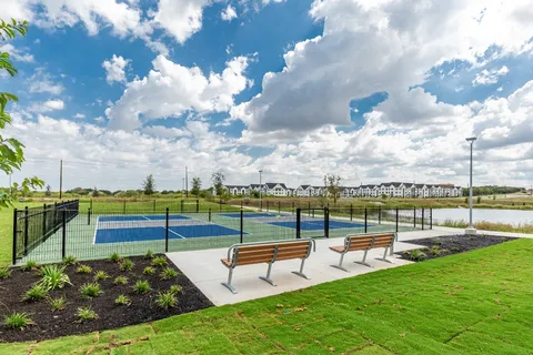 a view of a lake with couches in the patio