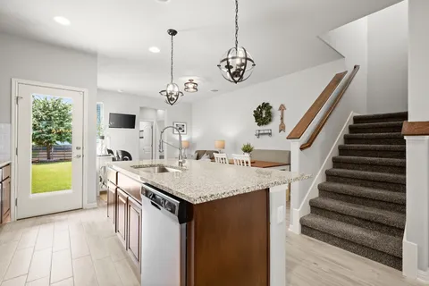a very nice looking dining room with a table and chairs