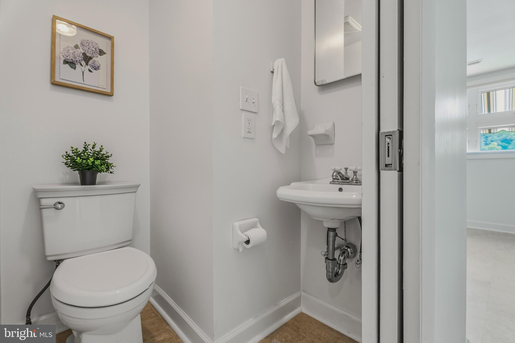 2425 Albert Rill Road Hampstead, MD 21074 - Photo 32 of 44 a bathroom with a toilet sink and mirror