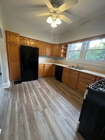 a black and white kitchen with a stove