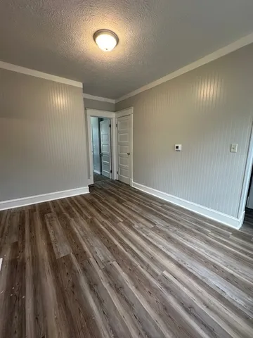 a view of wooden floor and staircase in a room